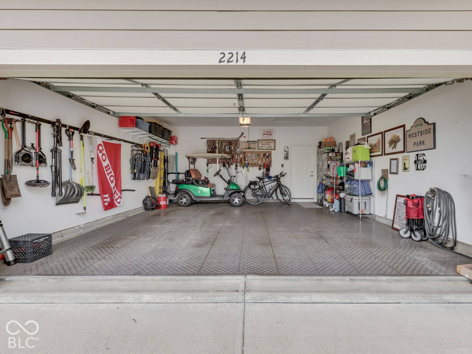 Great garage with custom flooring. Room for the golf cart!