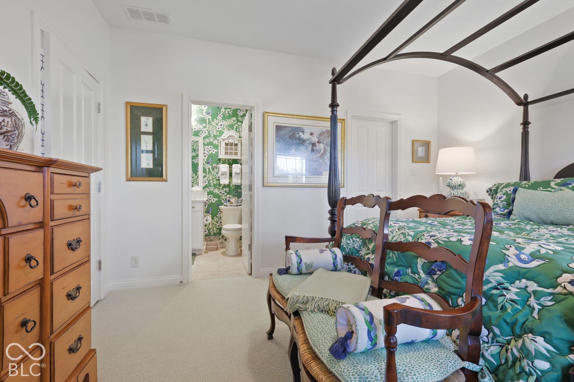 White walls complement the light-toned carpet flooring