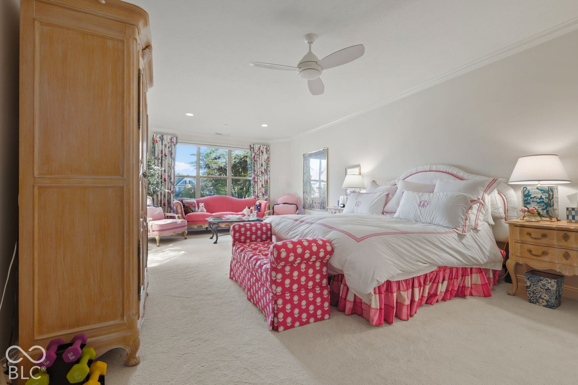 White walls with crown molding, ceiling fan, and carpeted flooring
