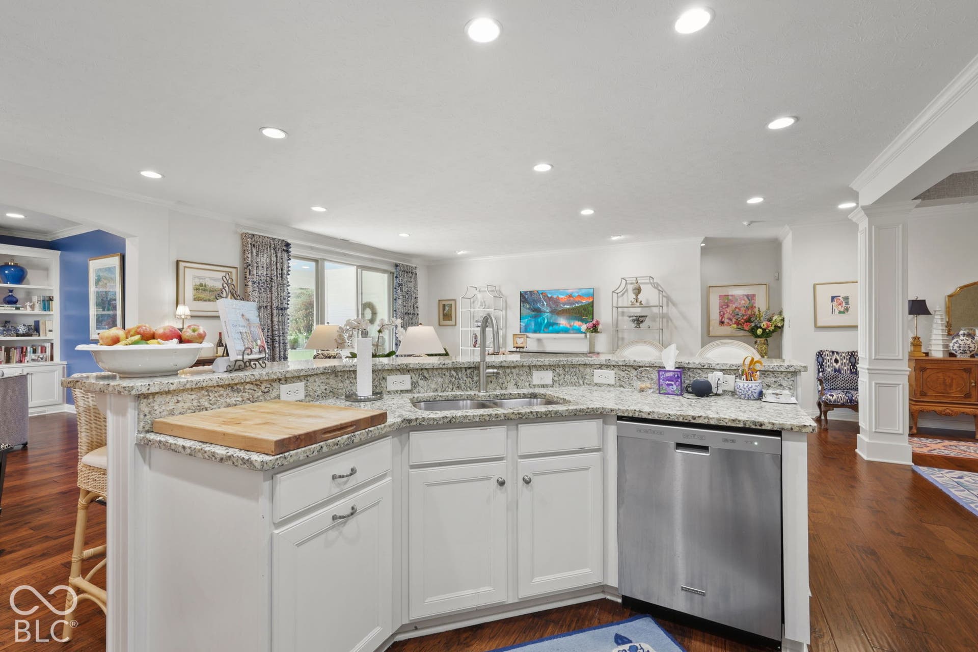White cabinetry, stainless steel dishwasher, double basin sink, light-toned countertop, and recessed lighting