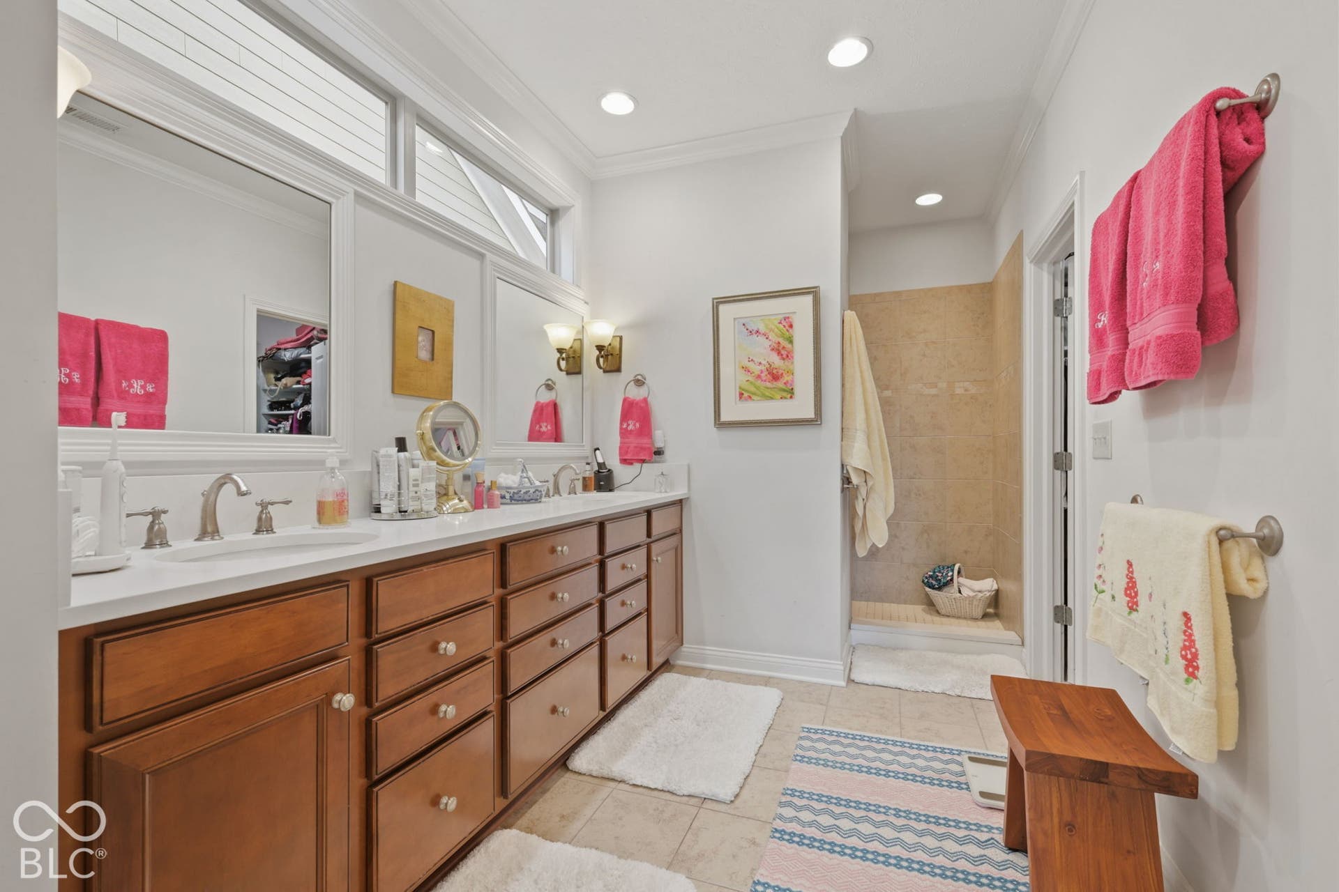 Dual vanity with undermount sinks and extensive storage cabinetry