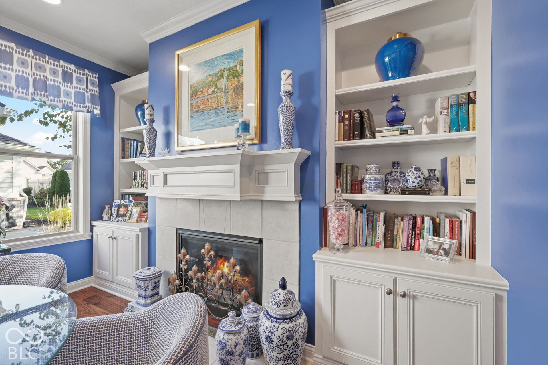 Fireplace with a tile surround and decorative screen