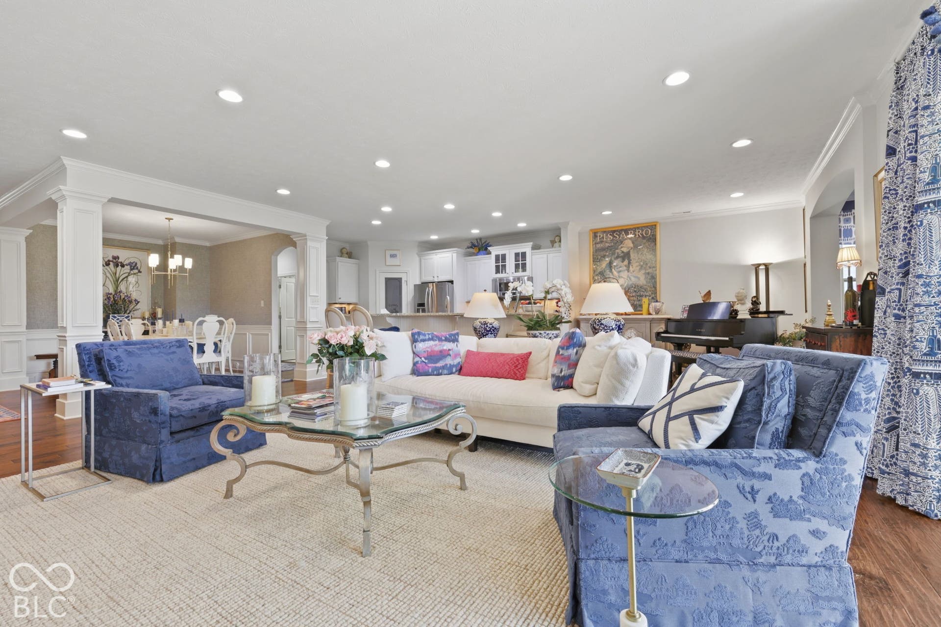 Recessed lighting, wood-finish flooring, and white crown molding