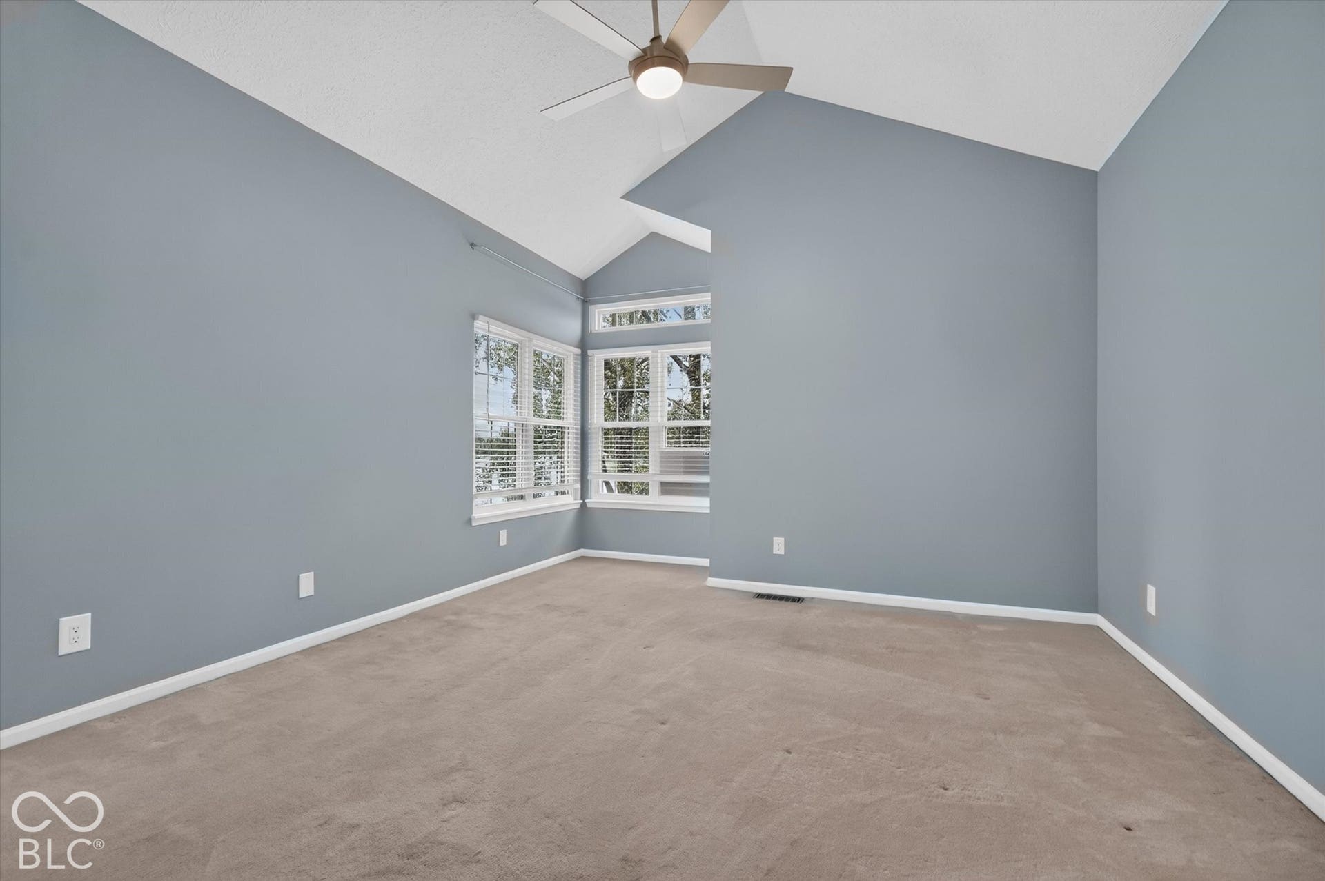 NEW CARPET INSTALLED after this photo was taken! Vaulted ceilings, a contemporary ceiling fan, and carpeted flooring