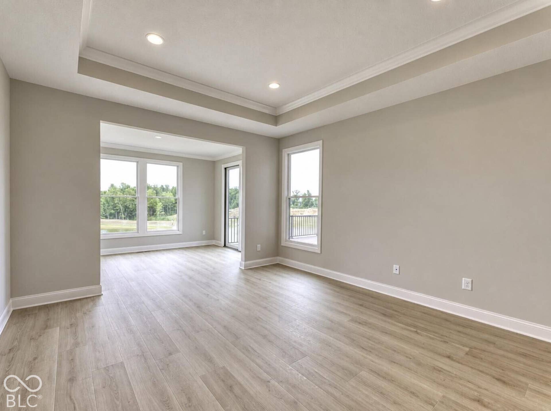 Primary Bedroom with sitting room. Photo shown is of a similar home/floor plan. Actual home may differ.