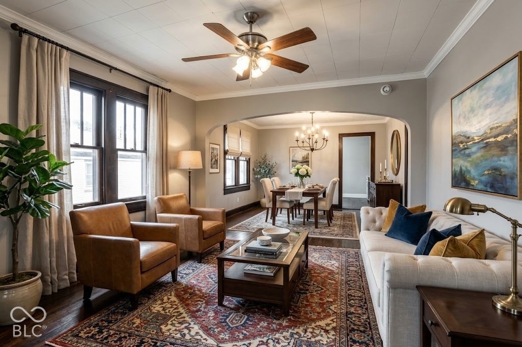 Virtually Altered - Hardwood flooring throughout, featuring a coved ceiling and crown molding