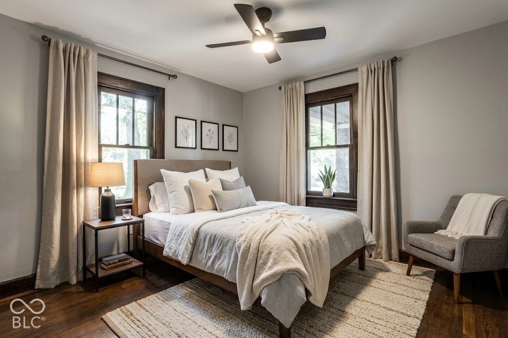 Virtually Altered - Wood-finish flooring with a textured area rug