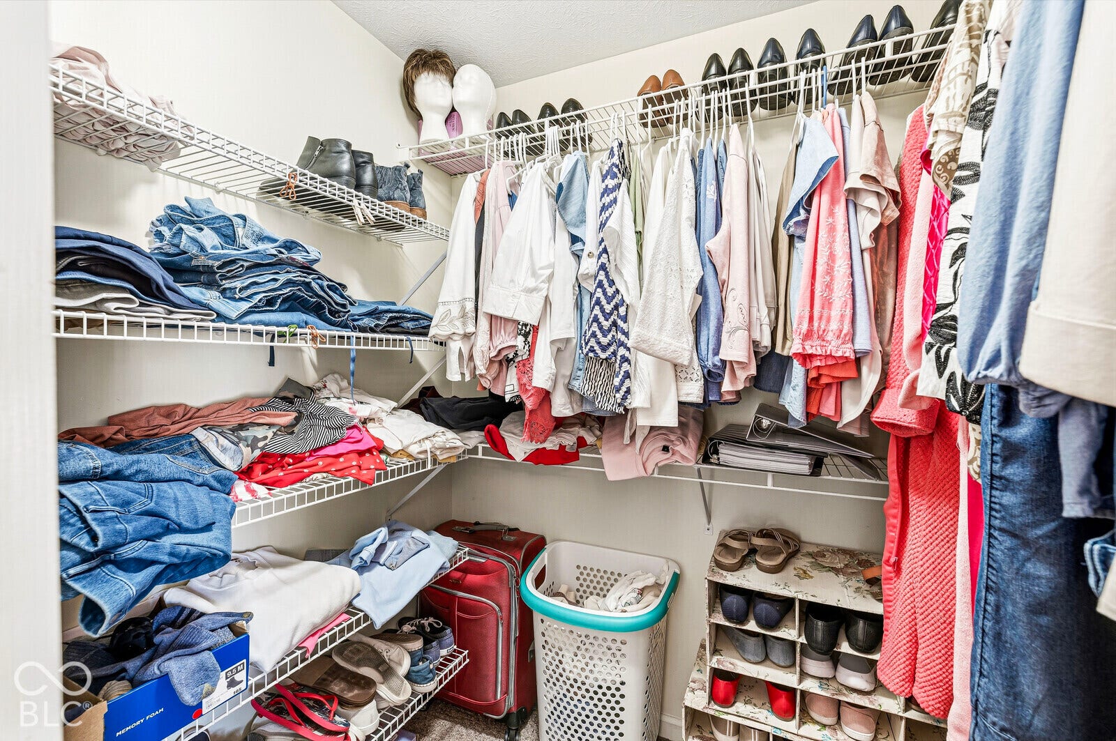 Primary bedroom walk-in closet