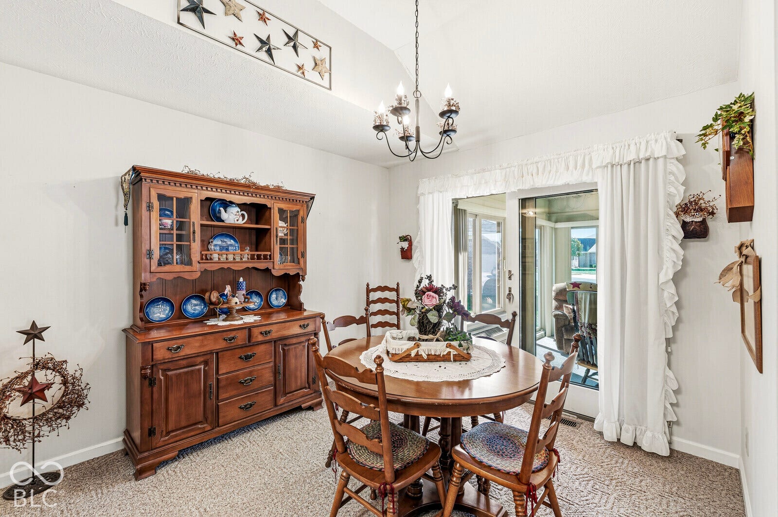 Dining area - approximately 12 x 10, vaulted ceiling, carpet, and access to a 4-season sunroom