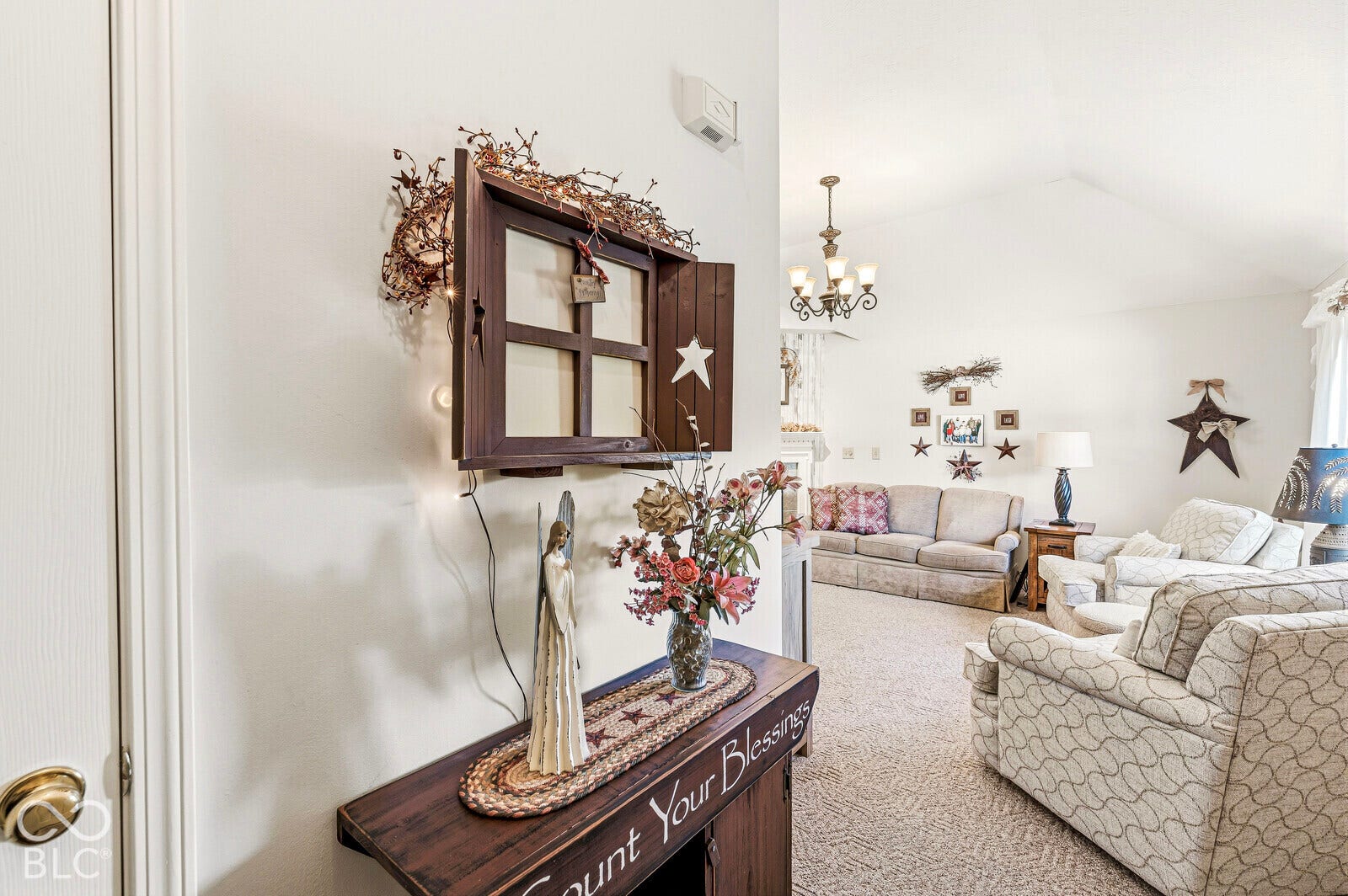 Spacious front door entry with coat closet and updated flooring