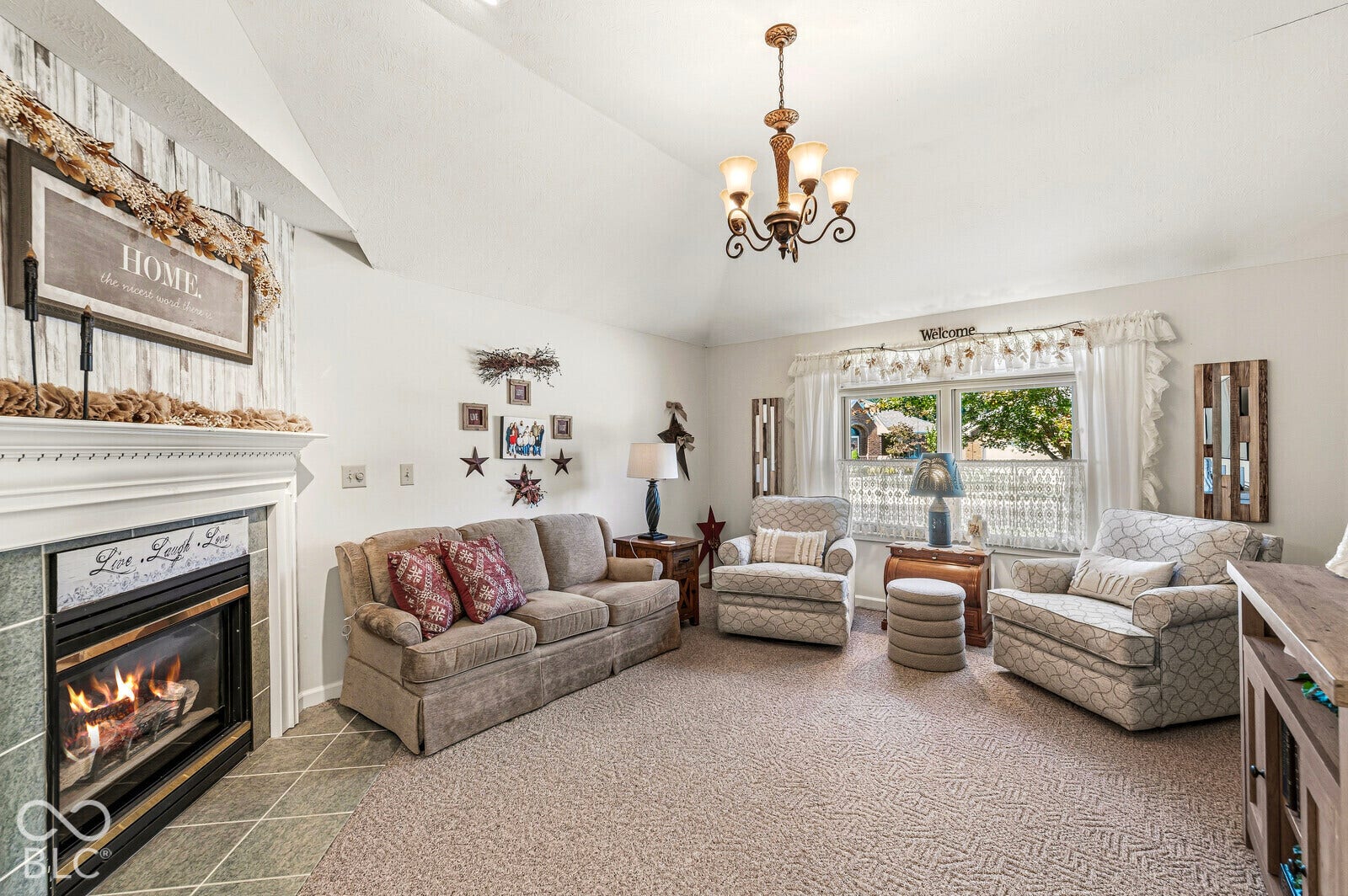 Living room - approximately 16 x 13 - Vaulted ceilings, a built-in gas fireplace with tile surround, updated carpet & paint