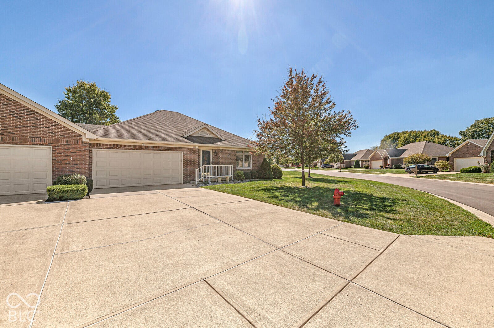 A common wall between the 2 garages enhances privacy between the 2 units. Plenty of driveway space for visitors. Updated garage door opener