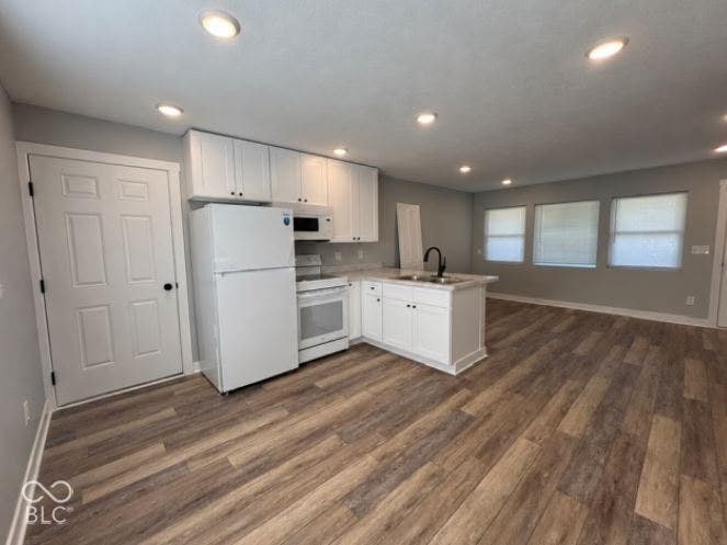 252 Indiana Street, Plainfield, IN 46168 Open-concept living area with wood-finish flooring