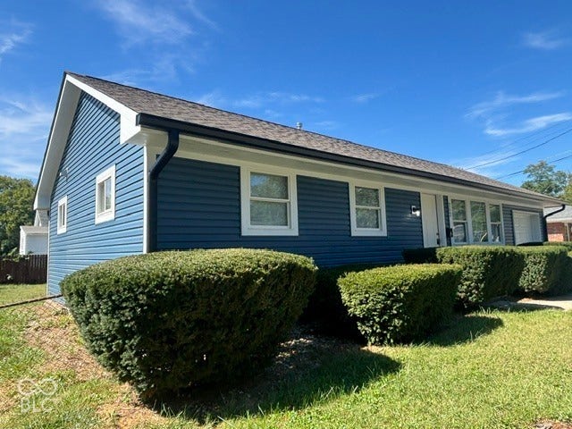 252 Indiana Street, Plainfield, IN 46168 Blue horizontal siding exterior with white trim, dark shingle roof, and white-framed windows