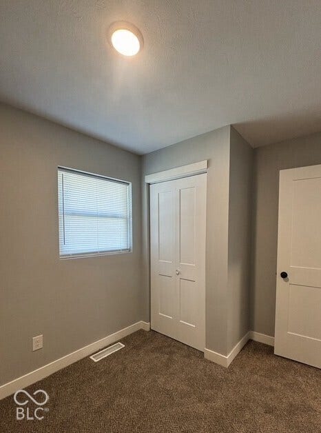 252 Indiana Street, Plainfield, IN 46168 Recessed ceiling lighting, textured carpeting, window with blinds, bi-fold closet doors, and white trim