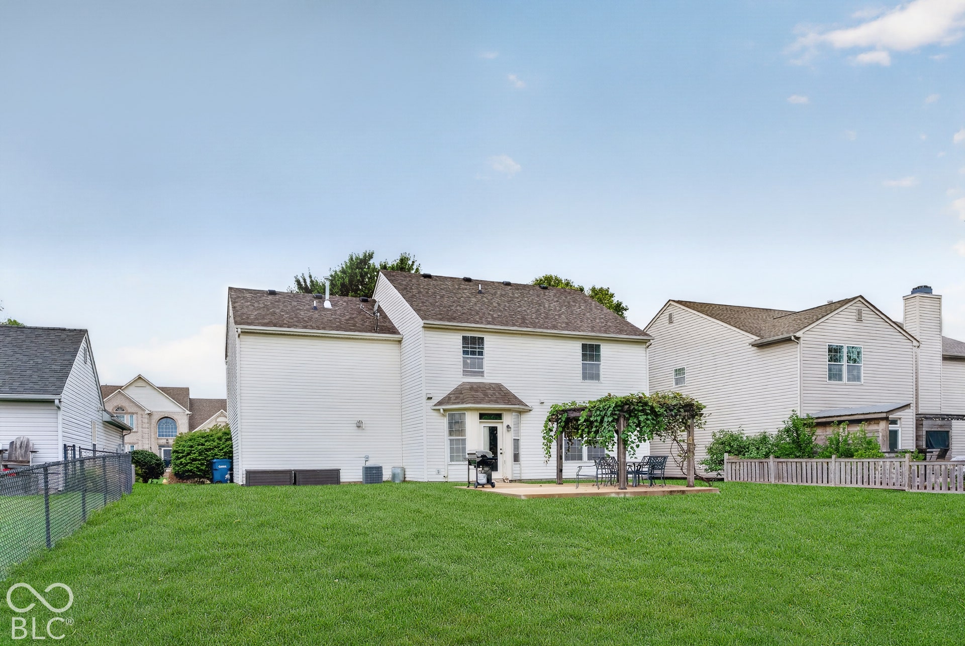 15996 Arbor Grove Boulevard, Noblesville, IN 46060 Expansive grassy yard featuring a concrete patio with an attached pergola