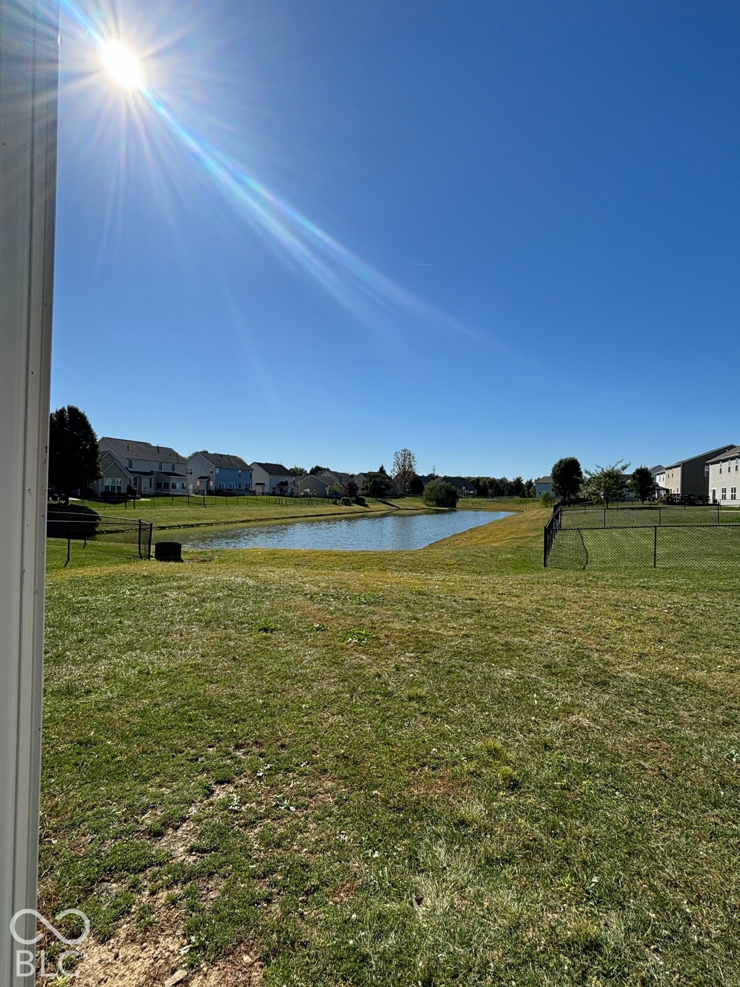 4348 Big Leaf Lane, Indianapolis, IN 46239 Expansive green space featuring a pond and surrounding residences