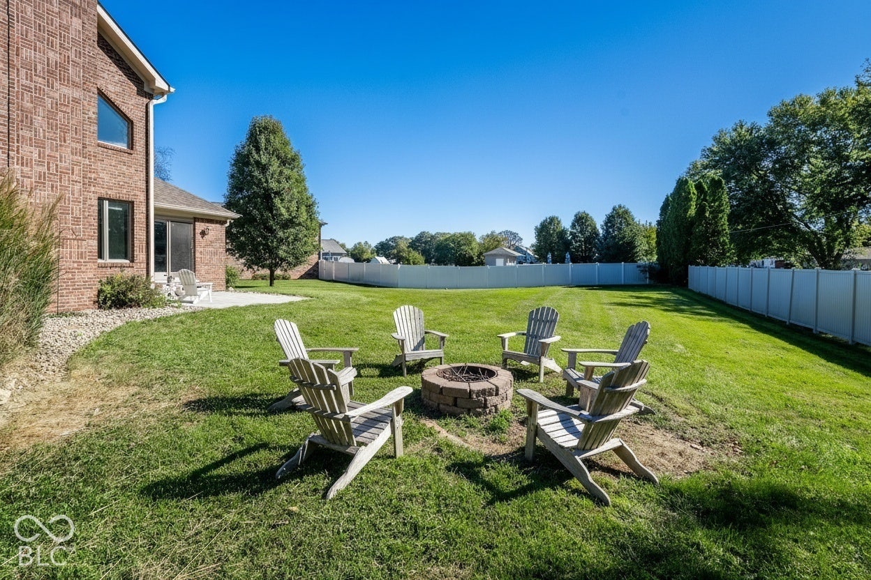 Expansive green space, virtually staged fire pit area