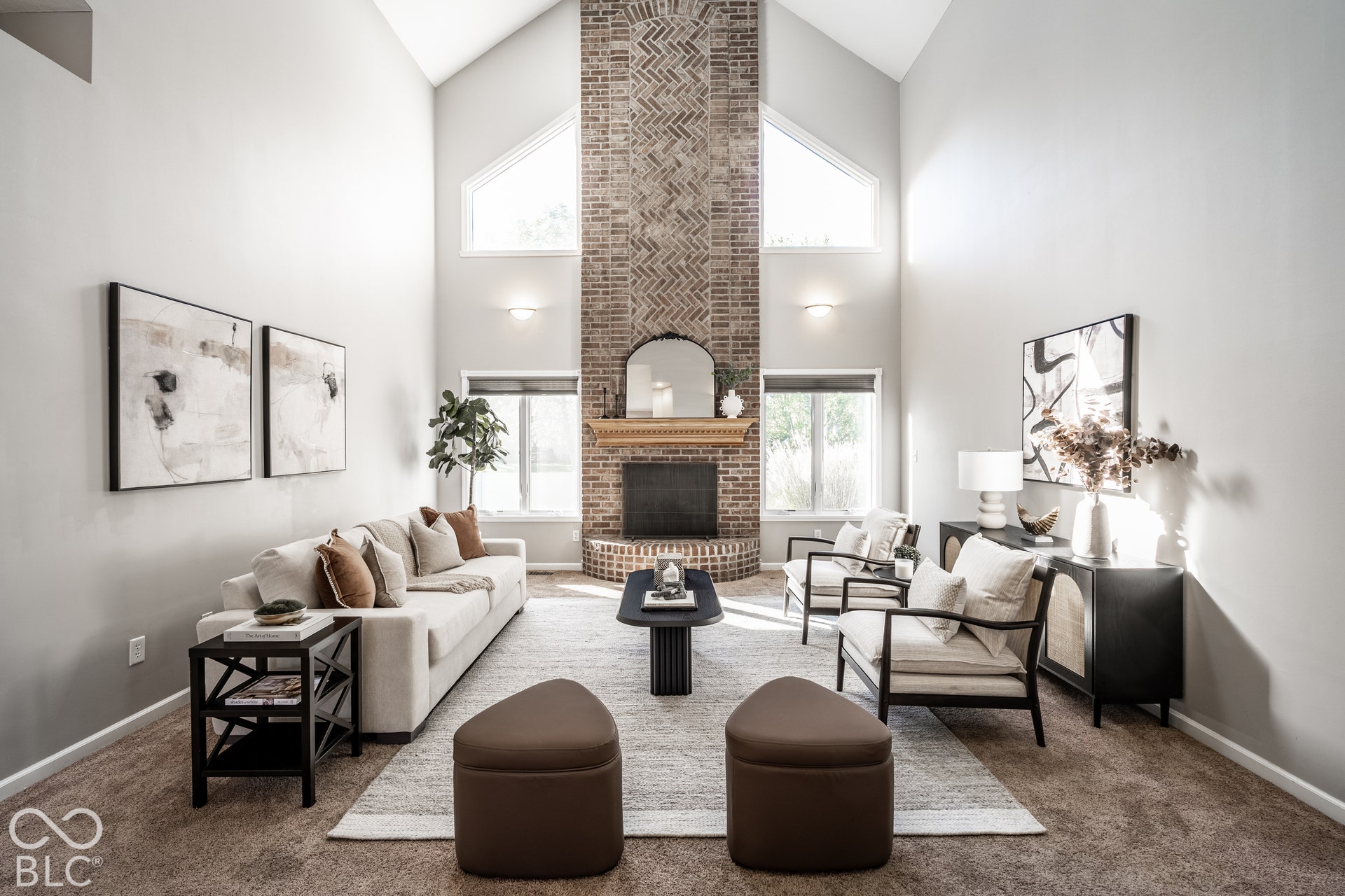 Vaulted ceiling with high windows, fireplace