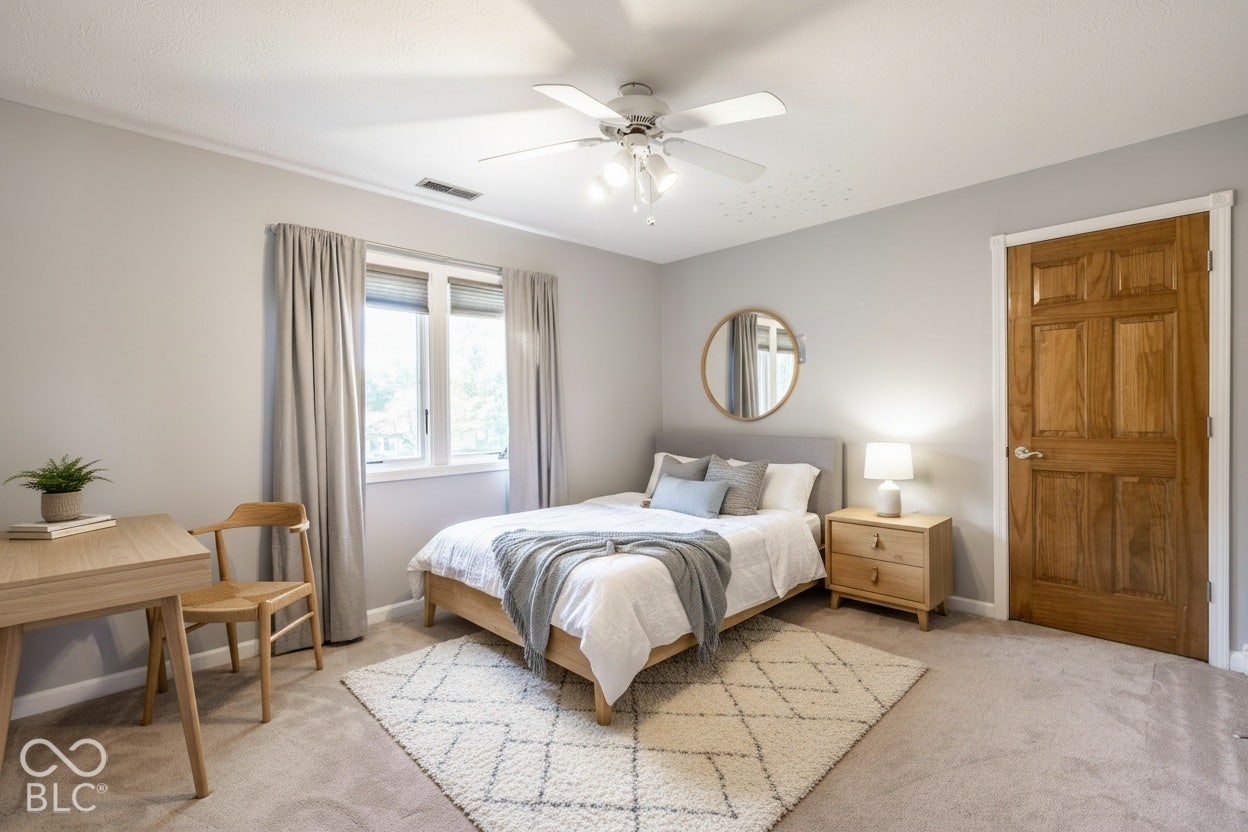 Bedroom 2 with walk-in closet. Virtually staged.
