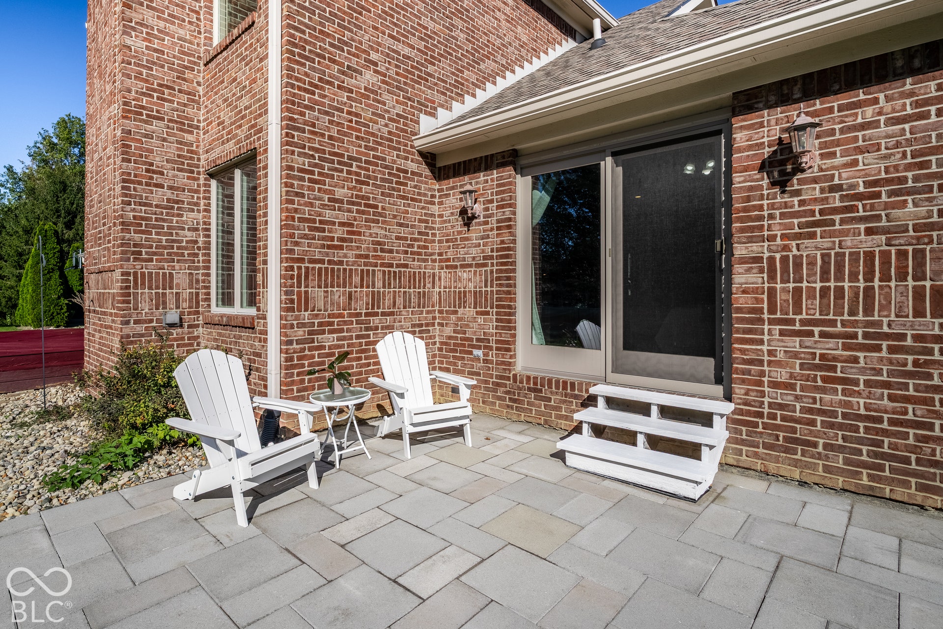 Private paver patio off of primary bedroom
