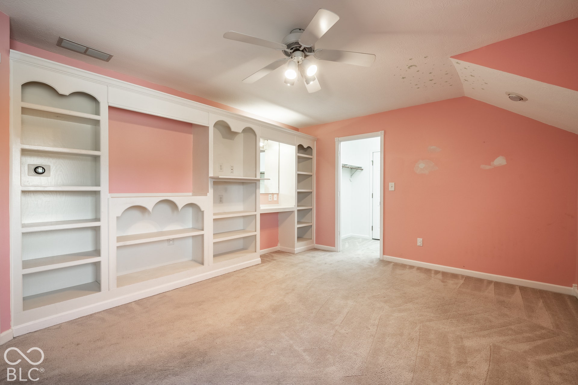 Bedroom 3 with built-in and walk-in closet, doorway attic access in back of walk-in closet