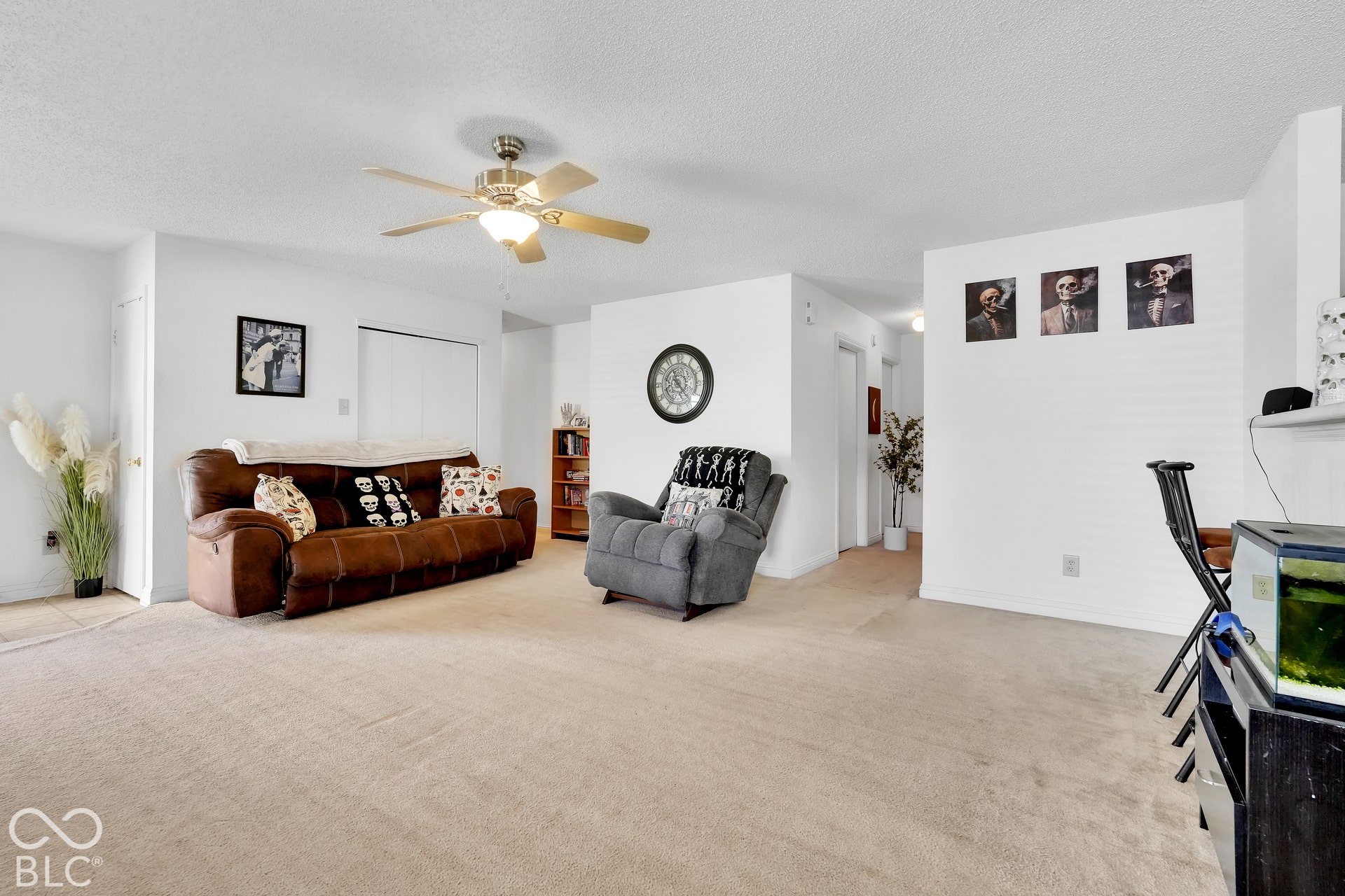Neutral wall color, ceiling fan with integrated lighting, and wall-to-wall carpeting
