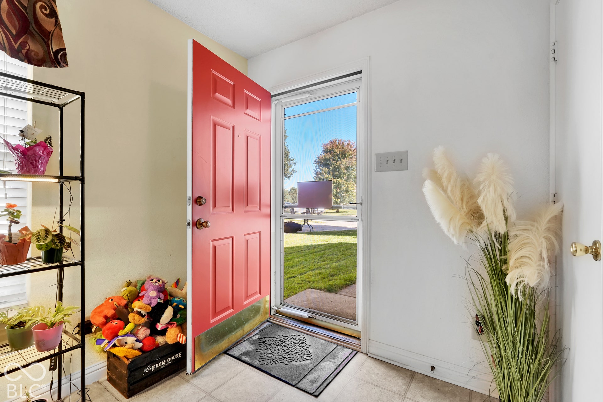 Red paneled entry door with brass hardware