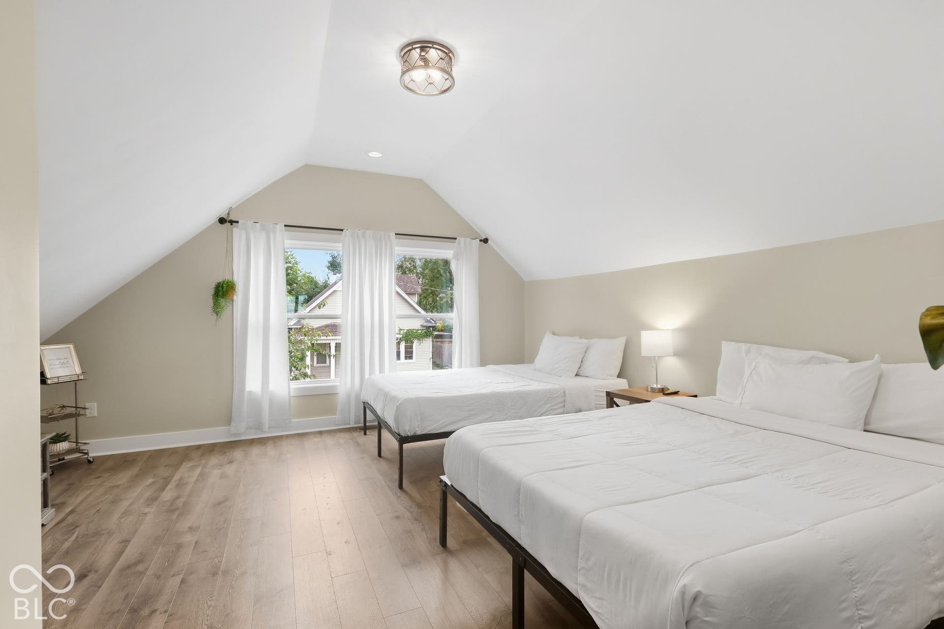 Wood-finish flooring, recessed lighting, and a semi-flush mount ceiling fixture