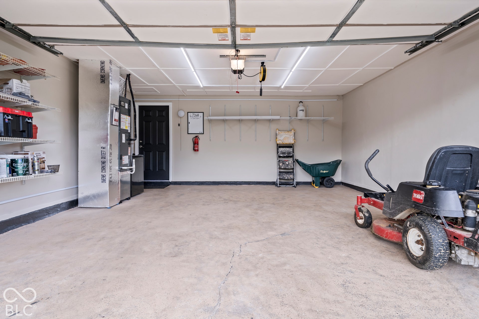 Fully renovatedAttached ceiling lighting with a concrete floor