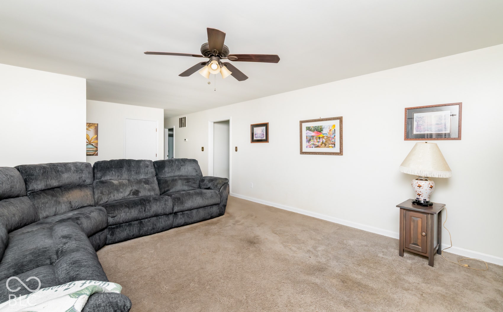 Neutral wall finishes and ceiling fan with integrated lighting