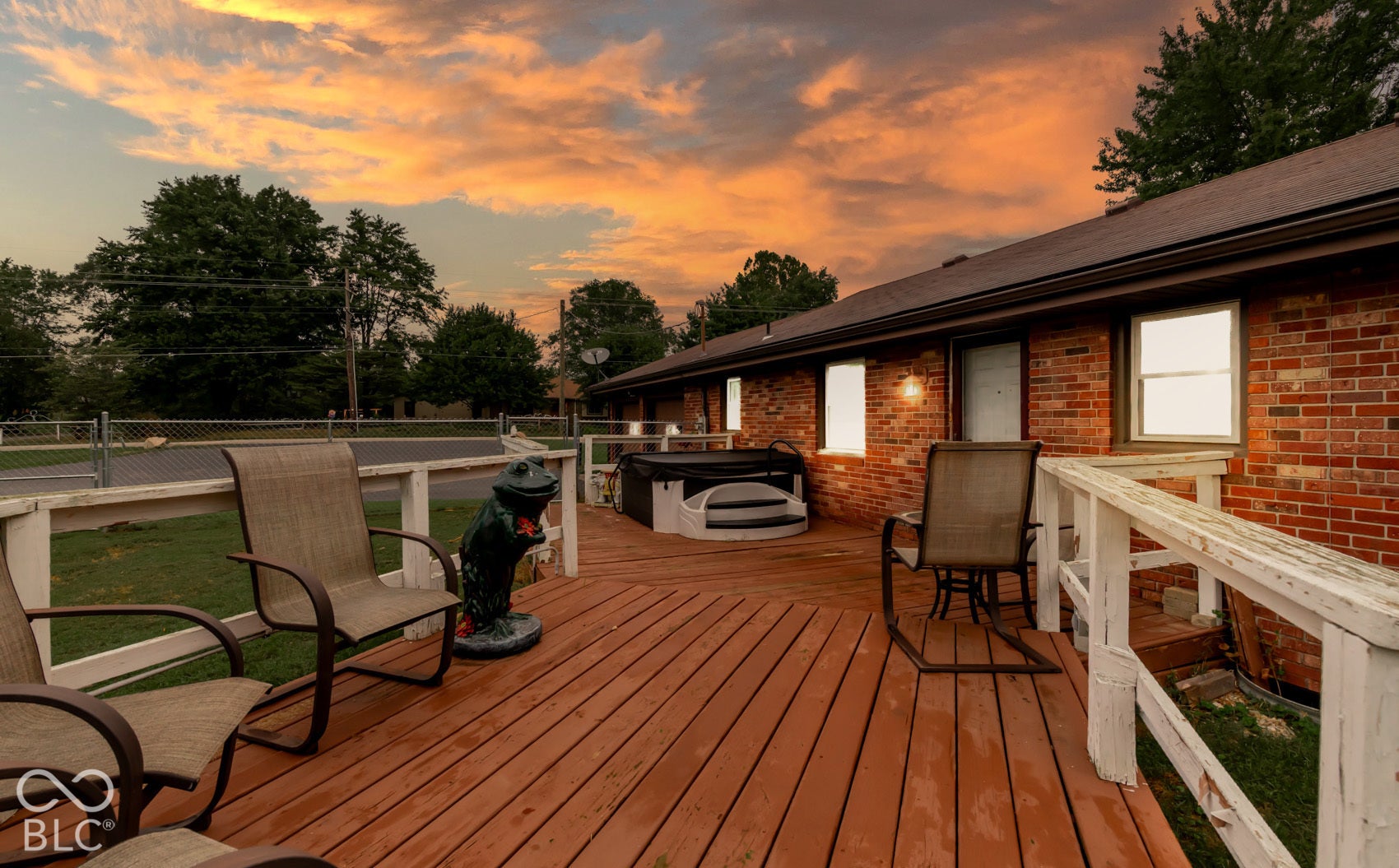 Expansive wooden deck with a built-in spa