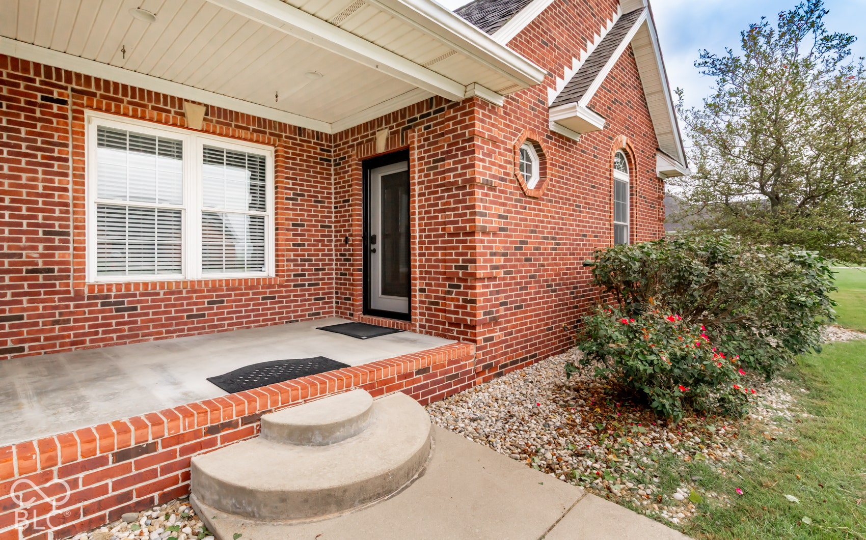 Brick exterior with a covered porch