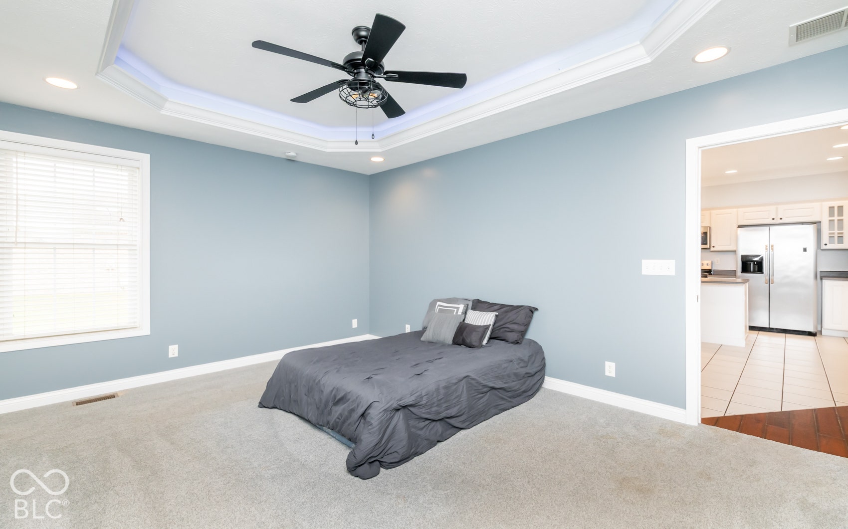 Tray ceiling with recessed lighting and crown molding