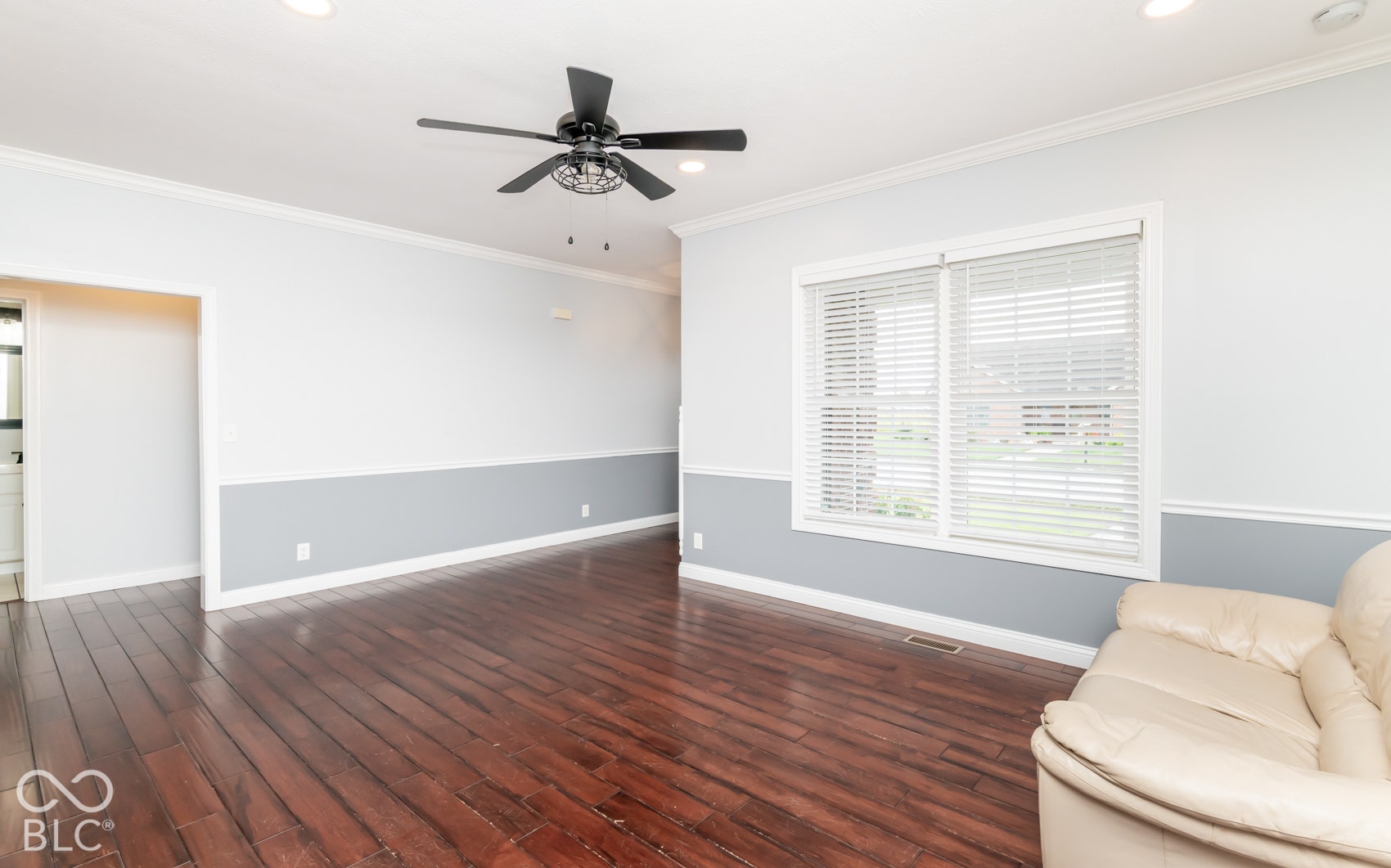 Hardwood-finish flooring, recessed lighting, crown molding, and a ceiling fan with integrated lighting