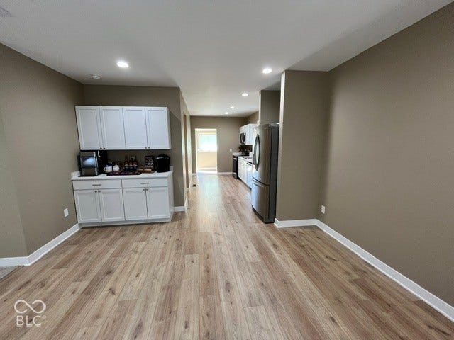 415 W Main, Greensburg, IN 47240 Laminate Wood-finish flooring, recessed lighting, and white cabinetry