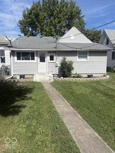 415 W Main, Greensburg, IN 47240 Rear of home, Light gray siding exterior with a shingled roof and small back porch