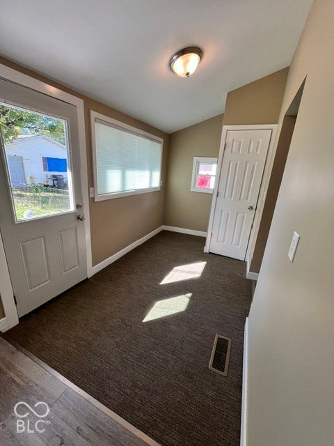 415 W Main, Greensburg, IN 47240 Neutral wall tones, carpet flooring, and natural light from multiple windows