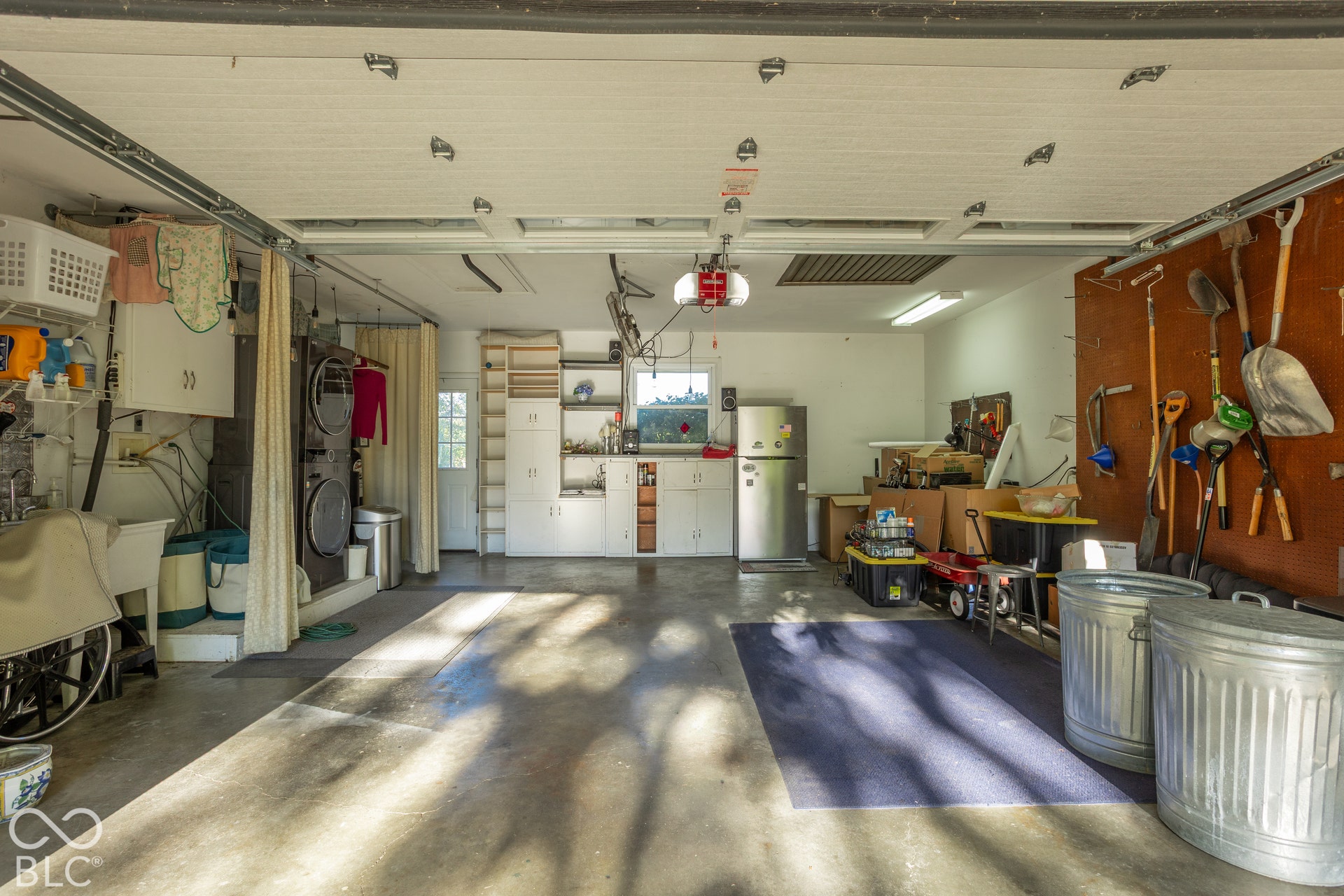 Deep garage with loads of storage and a working attic fan!