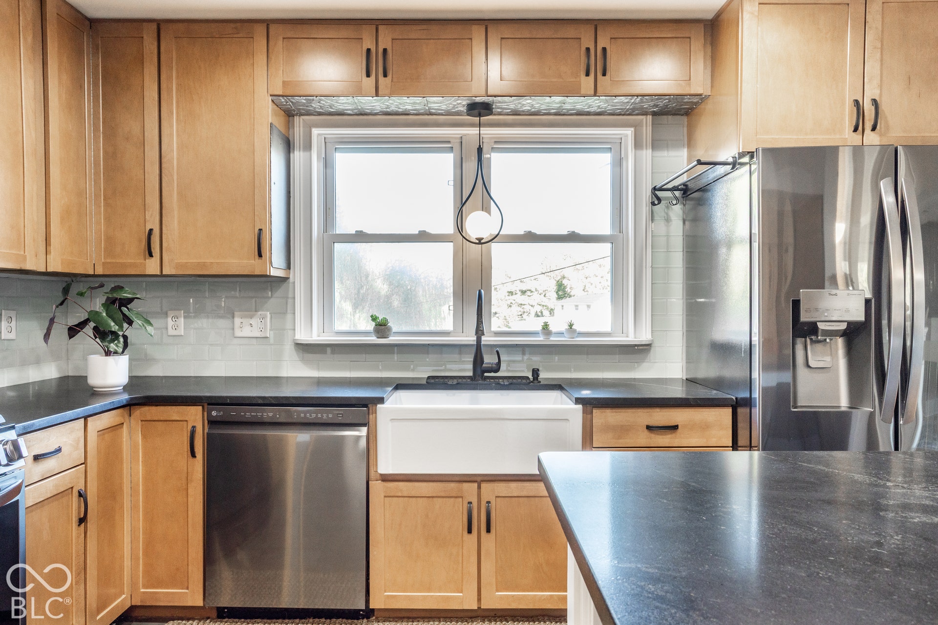 Custom cabinets, tile backsplash, newer appliances and a huge eat-in area with banquette