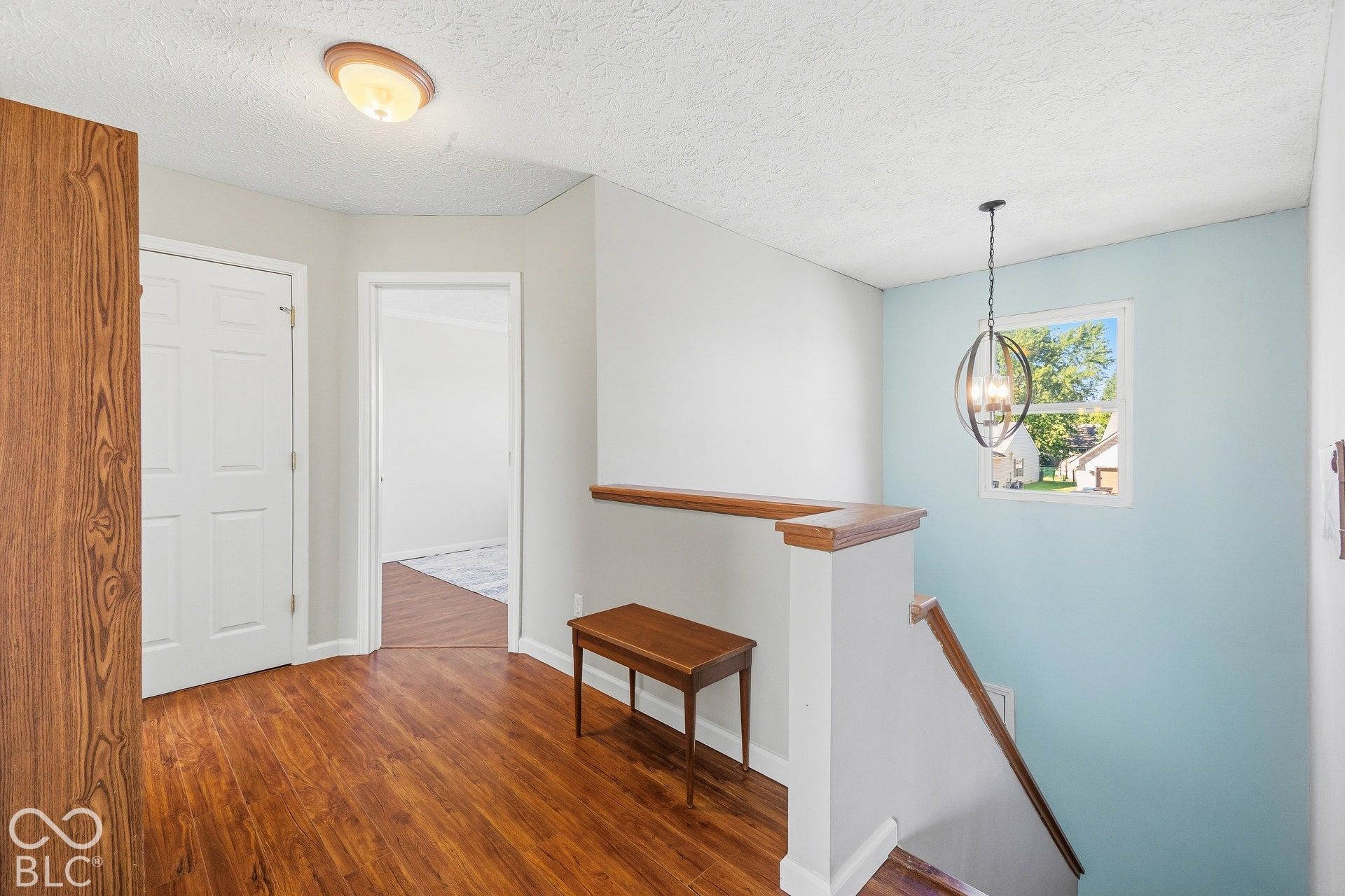 Wood-finish flooring throughout the landing