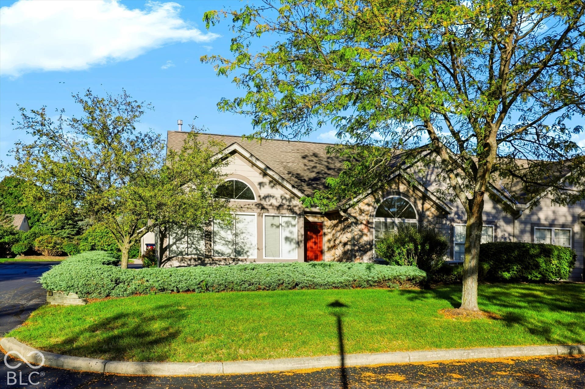 Stucco exterior with a pitched roof