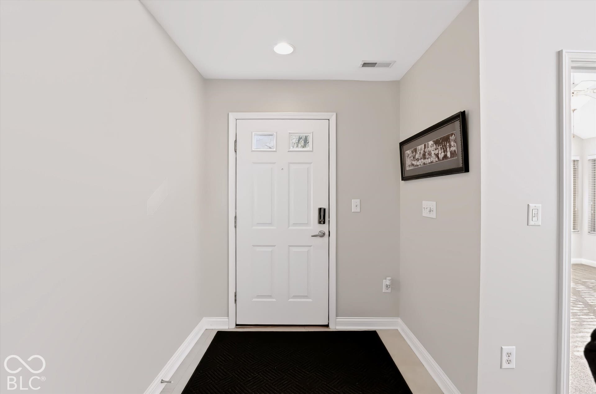 Entry door with decorative glass inserts and smart lock system