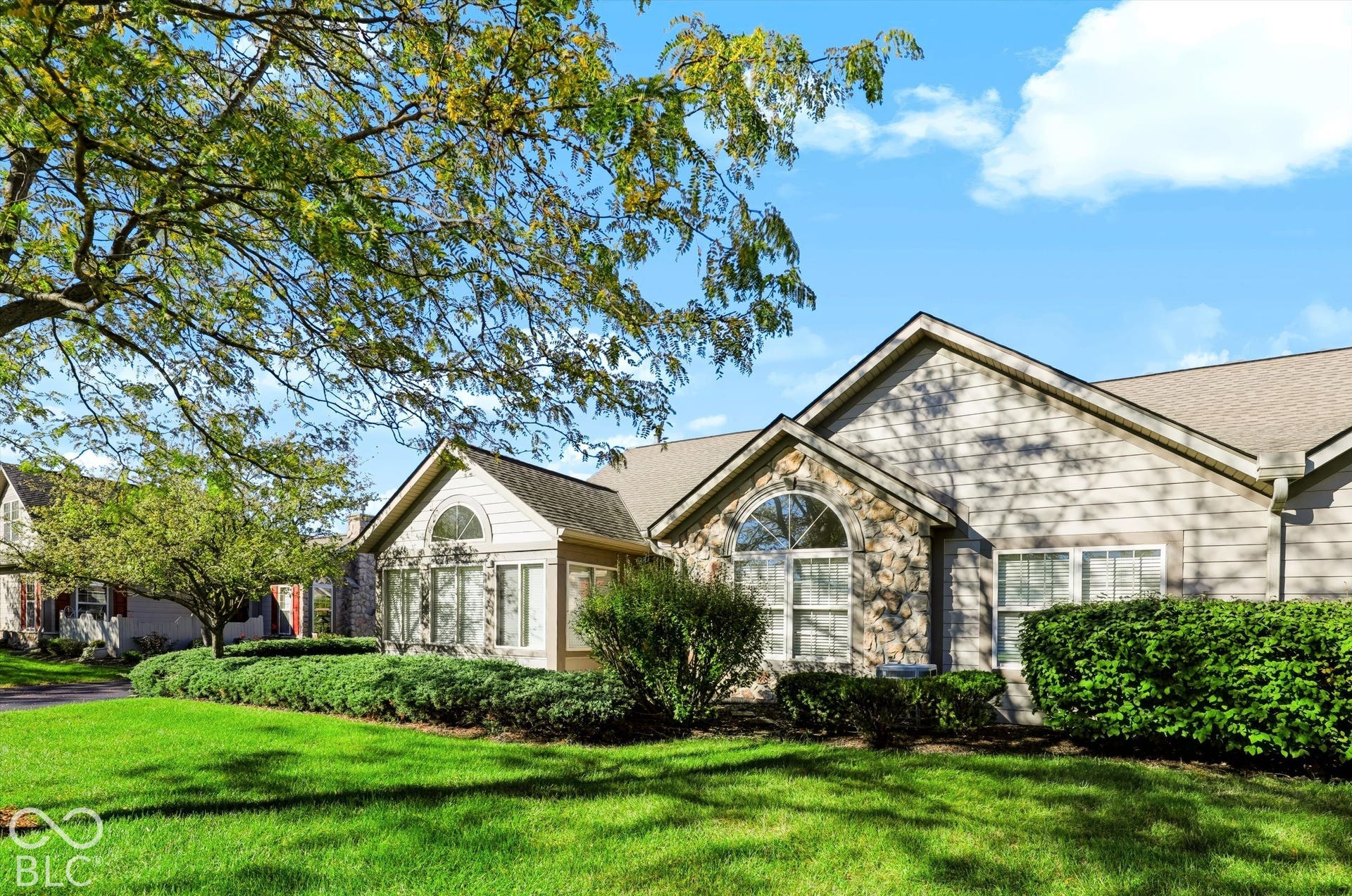 Stone and siding exterior with gabled roof lines