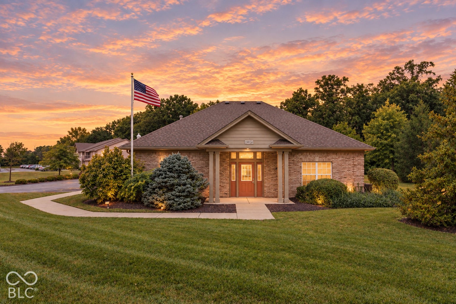 Brick exterior with a gabled roof and covered entry