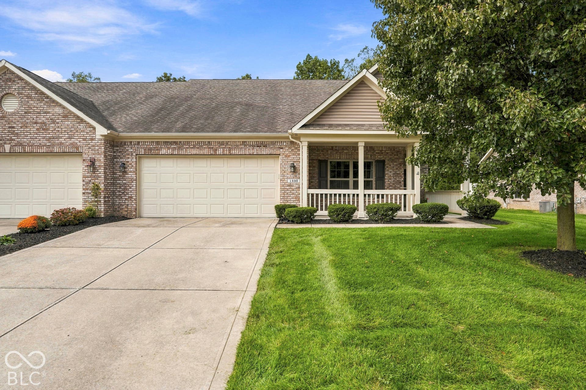 Brick exterior with a covered front porch