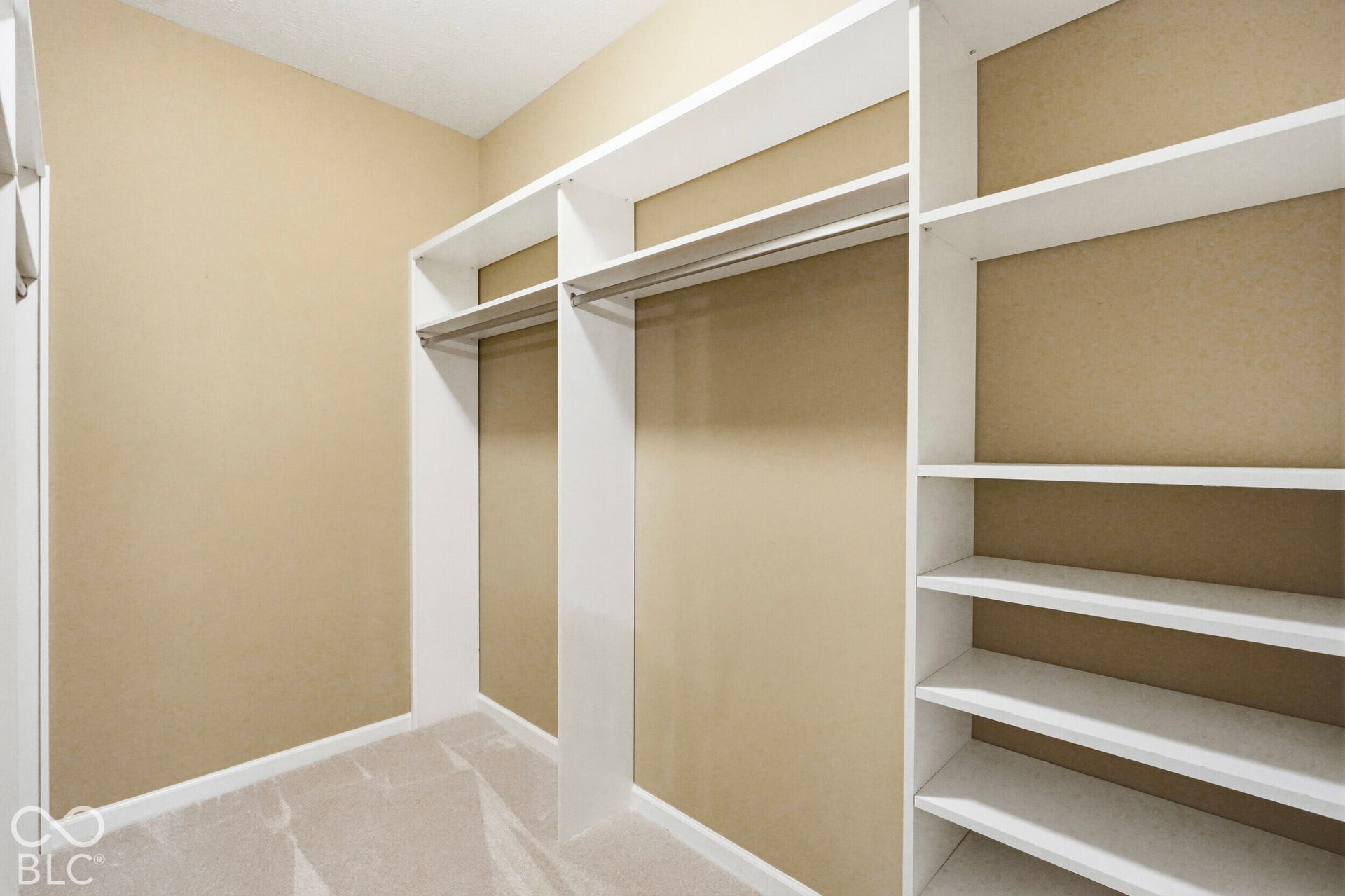 Built-in closet system with shelving and hanging rods