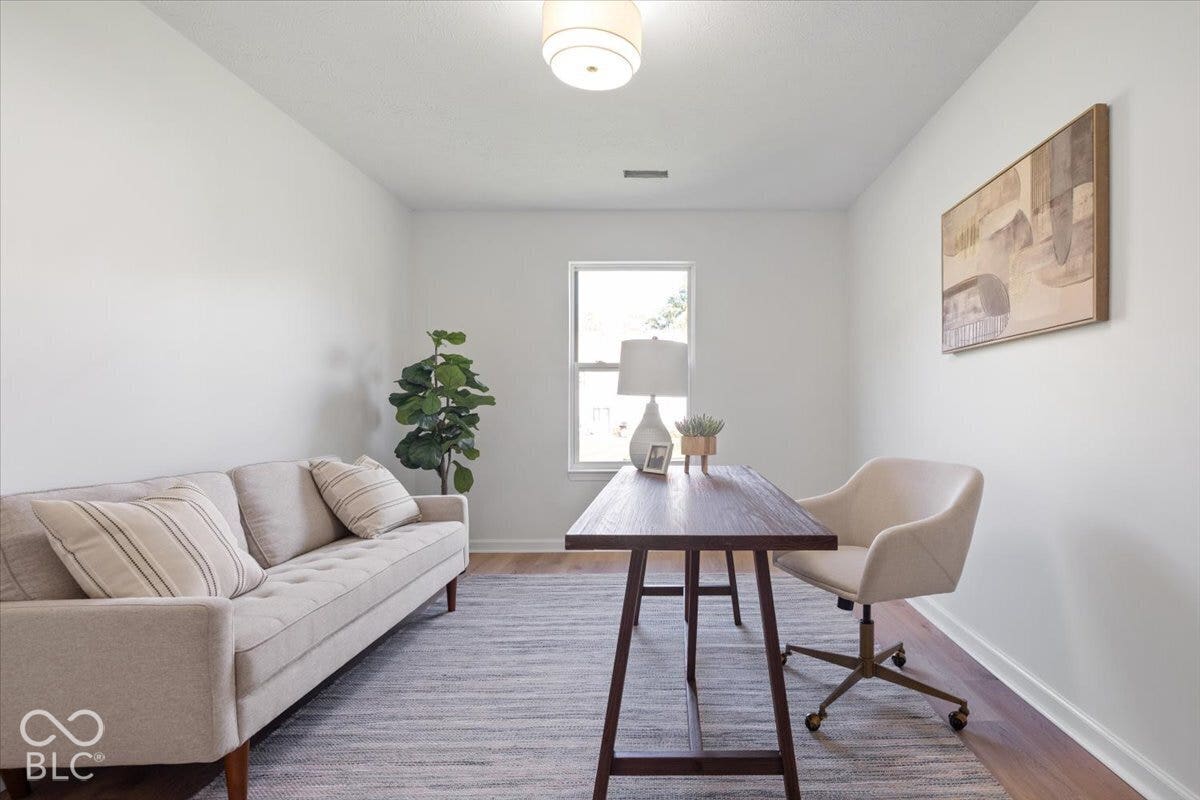 11780 Copper Mines Way, Fishers, IN 46038 Wood-finish flooring with crisp white walls and a single window