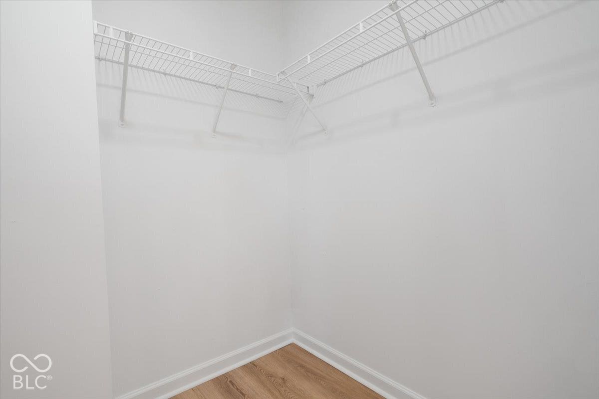 11780 Copper Mines Way, Fishers, IN 46038 Wardrobe space featuring white wire shelving and wood-finish flooring