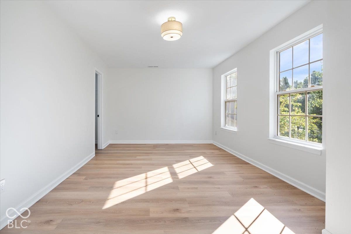 11780 Copper Mines Way, Fishers, IN 46038 Crisp white walls with wood-finish flooring